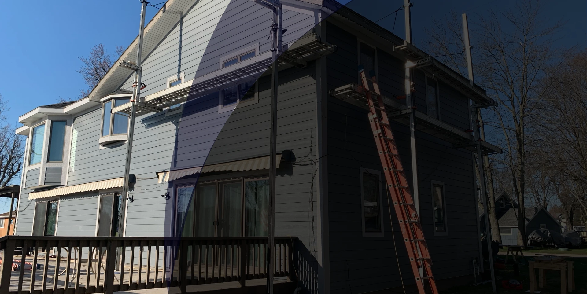 Anchor crew on ladder during siding replacement - real Anchor Siding LLC job in mid-Michigan