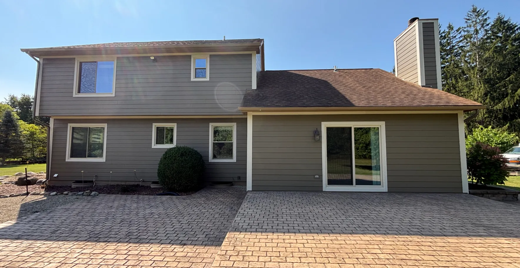 Taupe lap siding, finished home - real Anchor Siding LLC job in mid-Michigan