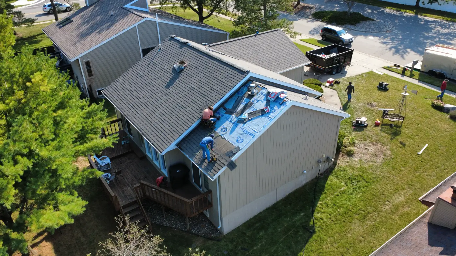 Aerial view of a cut-up roof with several valleys and dormers on a home in mid-Michigan