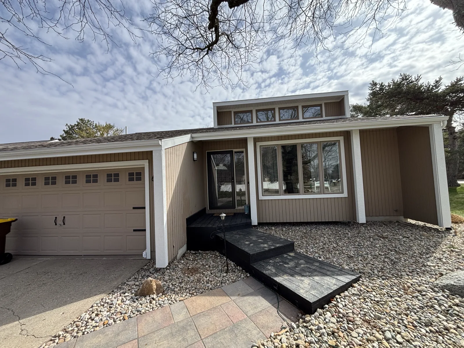 Clean siding lines on a modern home - real Anchor Siding LLC job in mid-Michigan